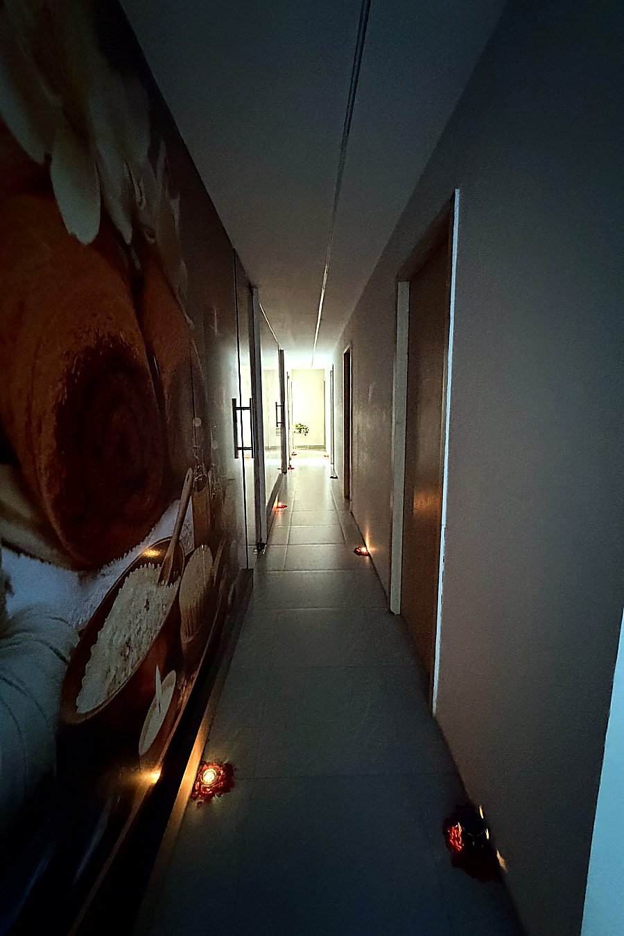 Candle-lit corridor at Vaayu Wellness Spa