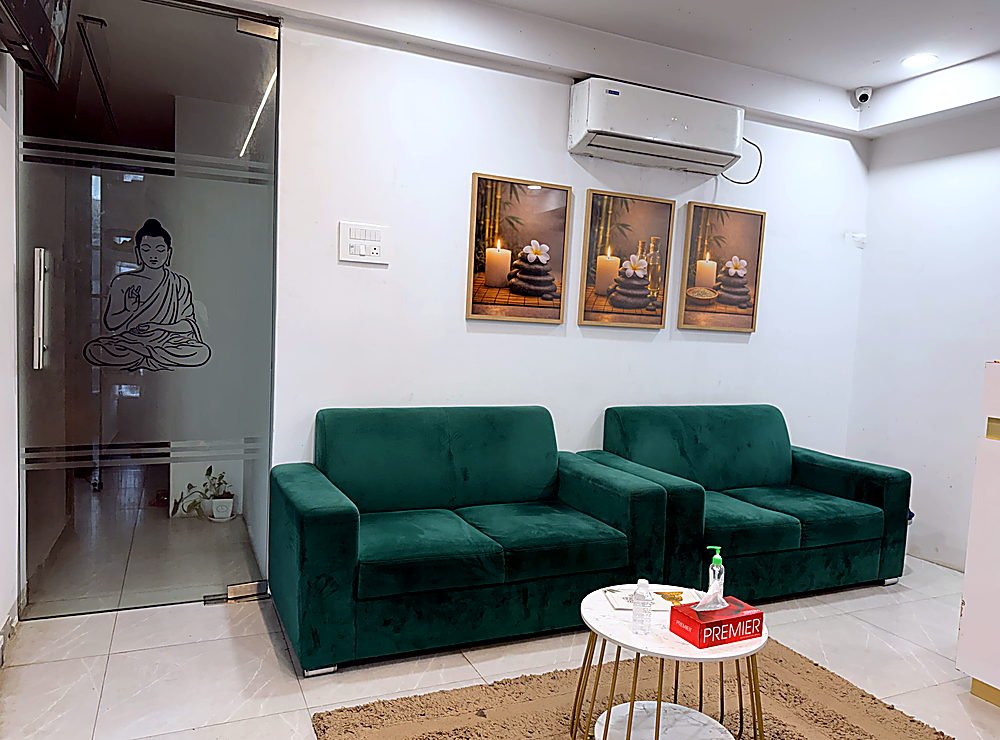 Reception lounge with green velvet sofas
